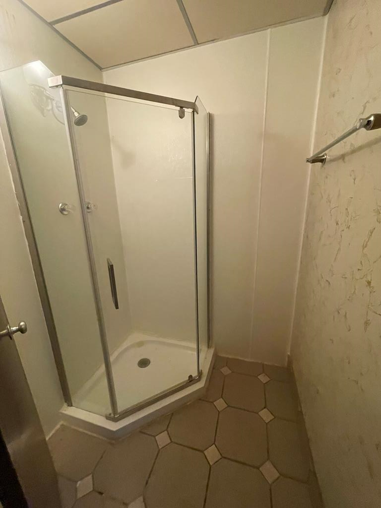 Shower in another room area 